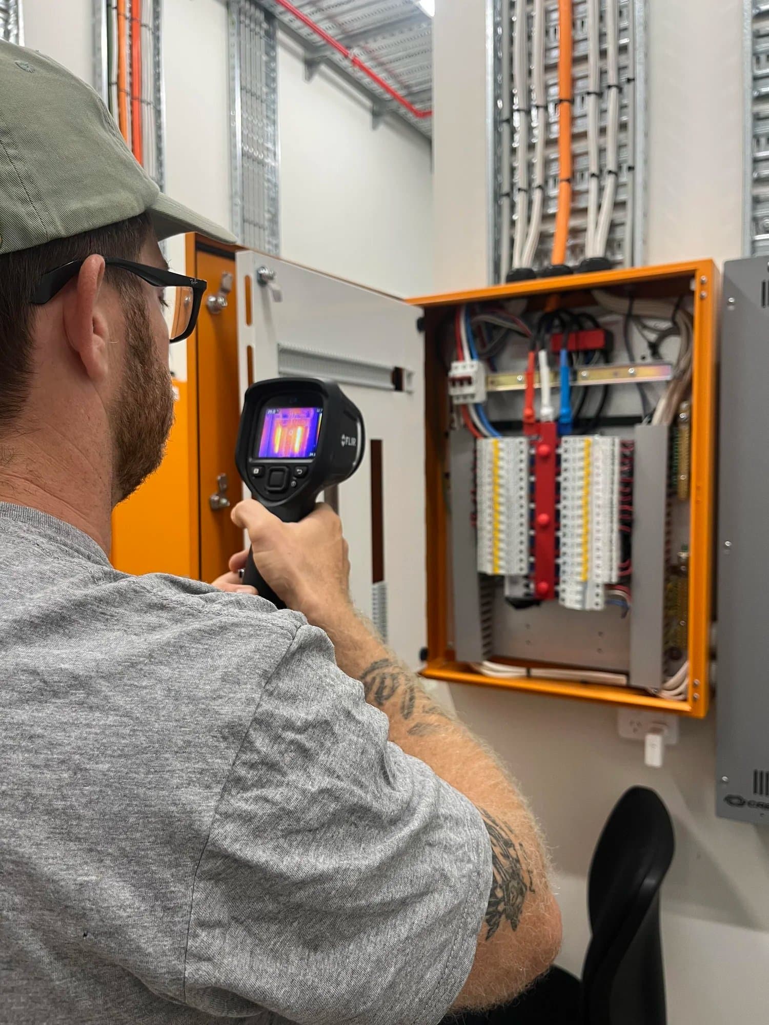 Thermal imaging camera pointed at a switchboard